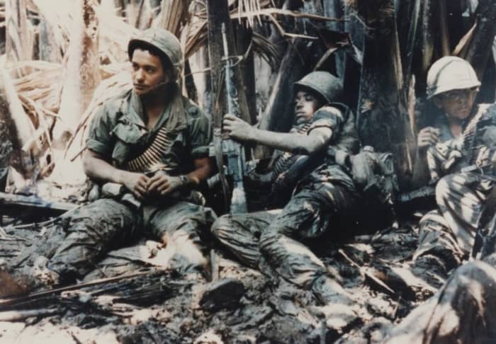 U.S. Army troops take a break during a patrol in Vietnam Conflict.