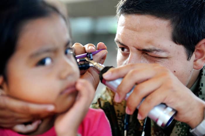 Child getting her ears checked.