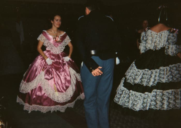 Indoor dances, like this one held in Youngstown OH, encourages ladies to wear fancier ballgowns since there's no fear of getting mud on them!