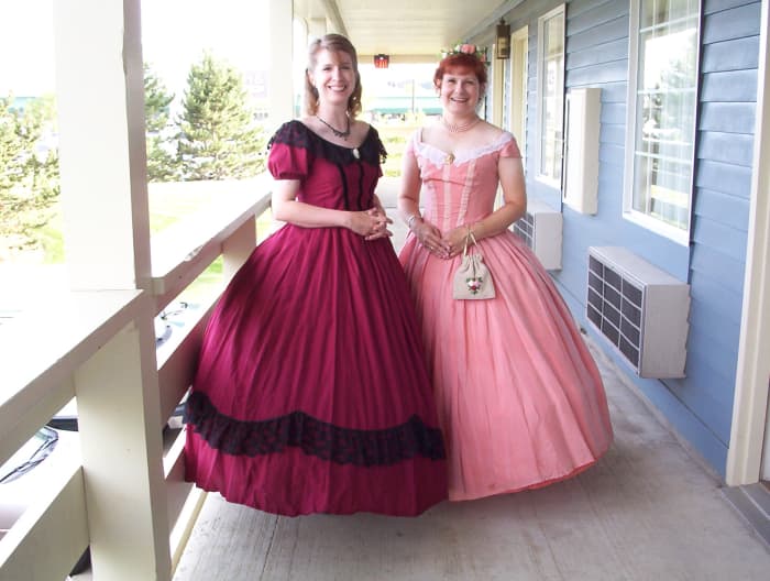 My sister made the dress on the left; the dress on the right is the same one shown above, now worn by my friend Joan, who heard me talking about reenacting and wanted to try it out. I have cool friends!