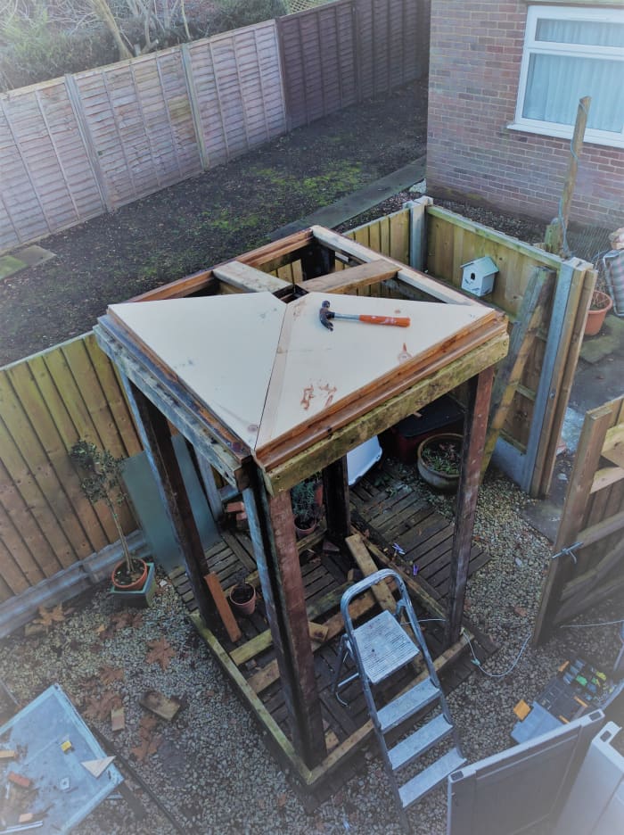 The roof frame resembled a Union Jack lifted in the middle. The central open ended wooden box served to lift the roof creating the slope and a cavity into which the lamp could be fitted.