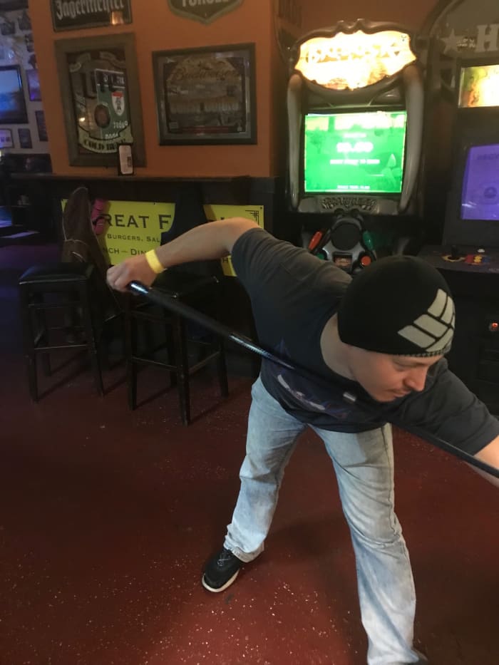 Inexperienced players often hold the cue too close to the butt, giving them less control over the stroke.