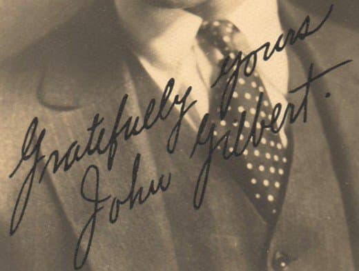 Rubber-stamped autograph of silent film star John Gilbert, one-time fiance of actress Greta Garbo.. Notice the dot after his last name. | Author's collection
