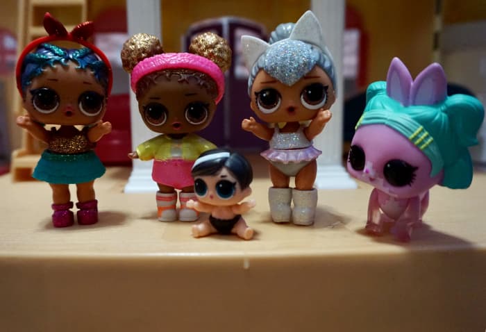 My daughter's L.O.L. collection from left to right: the singer, the basketball player, baby sister, the ballerina, and their beloved pet dog