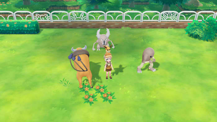 My character with three Pokemon I transferred over from Pokemon Go.