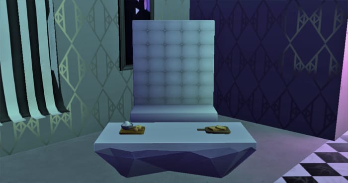 A cutting board with an unfinished sandwich and a cutting board with an unfinished cake left on a coffee table. It wasn't even the kind of cake I had wanted. No one ate at that wedding.