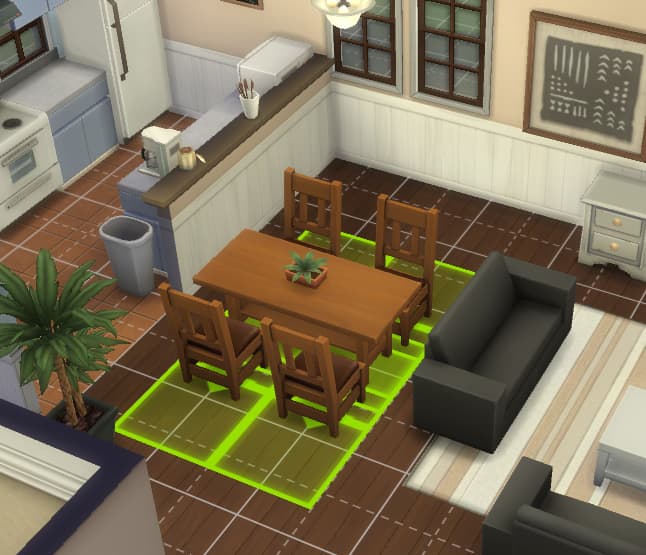 Being able to move items that go together in one group makes things easier. The green highlighted grid shows the space the items need for Sims to properly use them.