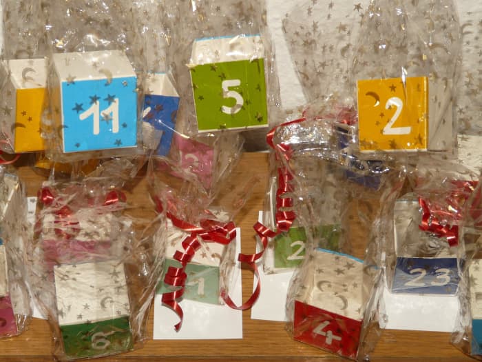 Think outside the box. No matter what size gift you want to put in each day on your custom advent calendar, there are plenty of creative ways to individually wrap and display your gifts.