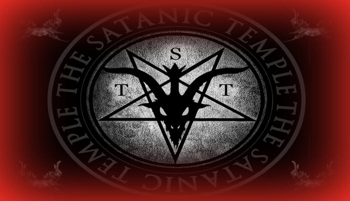 The logo of The Satanic Temple features a winged goat-headed devil within a pentagram.