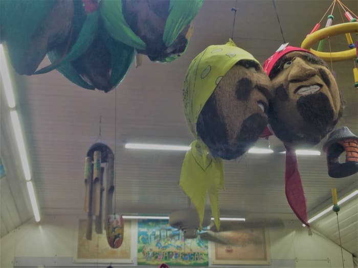Hanging accessories sculpted from coconuts are some of the unusual crafts in Devon House's T's and Treasures.