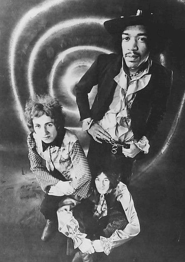 The Jimi Hendrix Experience. (from left), Mitch Mitchell, Noel Redding (sitting) and Hendrix.