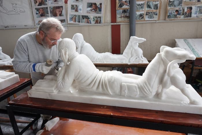 John Wall is busy working on a marble statue. Working with marble is for the more advanced sculptor.