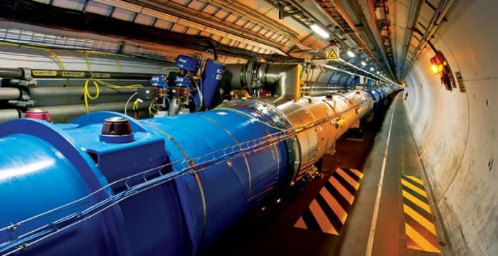 A view from inside the LHC tunnel, showing the beamline which contains the beams of particles that are accelerated.
