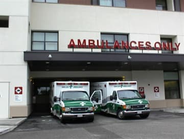 I took this picture of ambulances unloading patients at Twin Cities Hospital last summer, long before either of us had heart symptoms.