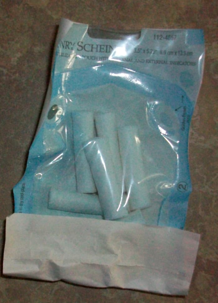 These cottony dental pads look a little like cigarettes. Try not to laugh, even if your child looks like he belongs in Fight Club with a swollen lip and a bloody "cigarette" between his teeth