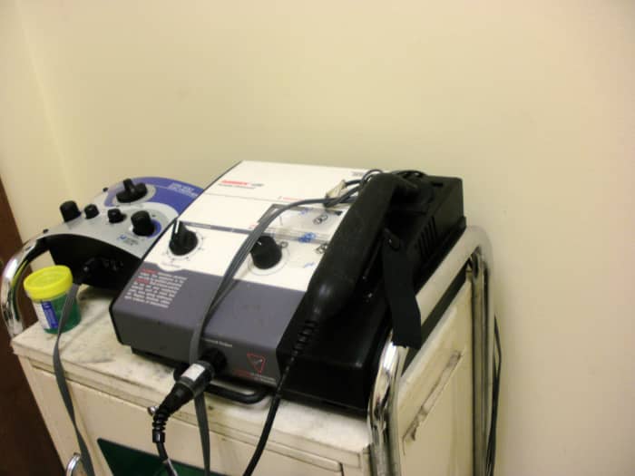 The machine on the right provides ultrasound therapy for foot pain. The one on the left is for electrostim therapy.