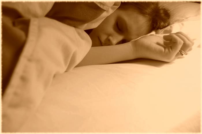 person sleeping in bed