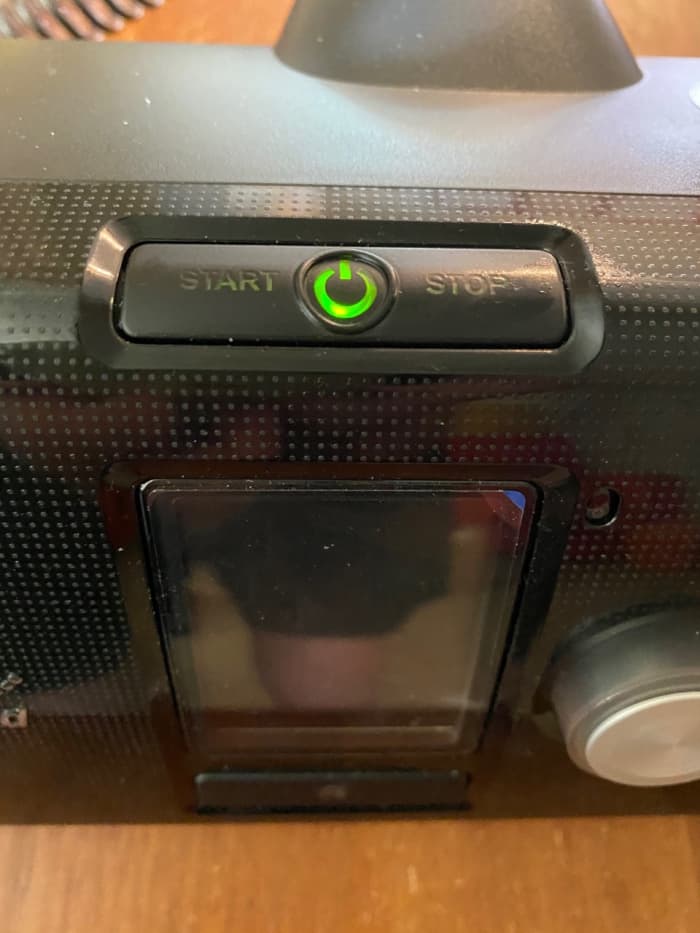 A button on top of the machine turns it on, which you use when ready to use the machine at bedtime, after you've put he mask on. Notice too, the screen on front and a knob to the right of it.