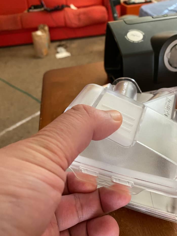 A sort of latch on the side of water container on CPAP. You pull it and open the container so you can fill it with distilled water for the humidifier.