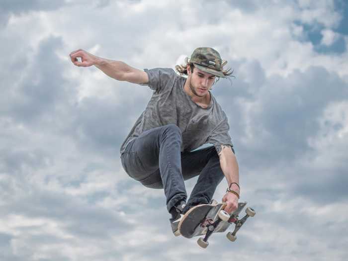 Learn more about how workwear became a fashion statement, like this skater demonstrates.