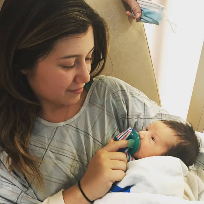 This was the first time I held my son after giving birth. We were briefly allowed to pull our face masks off for a picture since I did not get to hold him till almost 24 hours later.