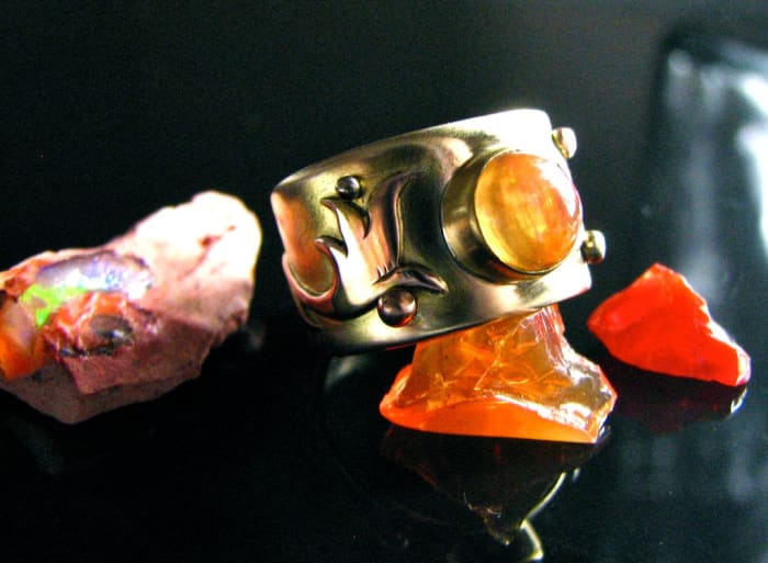Fire opal is a supportive stone that helps let go of grief.