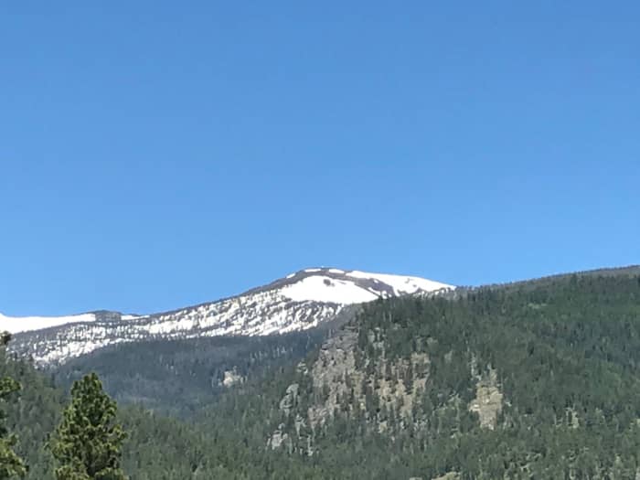 Look closely and you can see the wildfire lookout tower on the top of the snow capped peak.