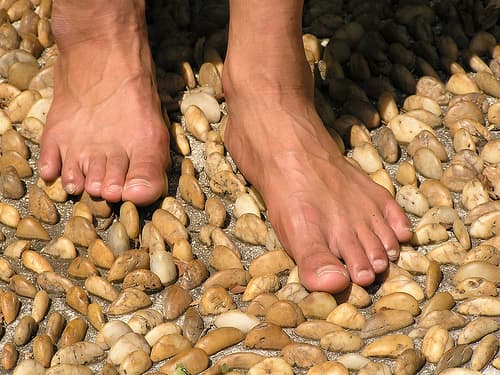 Here, I am experiencing the benefits of a foot reflexology path while walking barefoot.