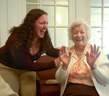 A good laugh is the best medicine. Physical therapy student Ashley Testa shares a laugh with a Legacy Senior Living resident, where she volunteers.