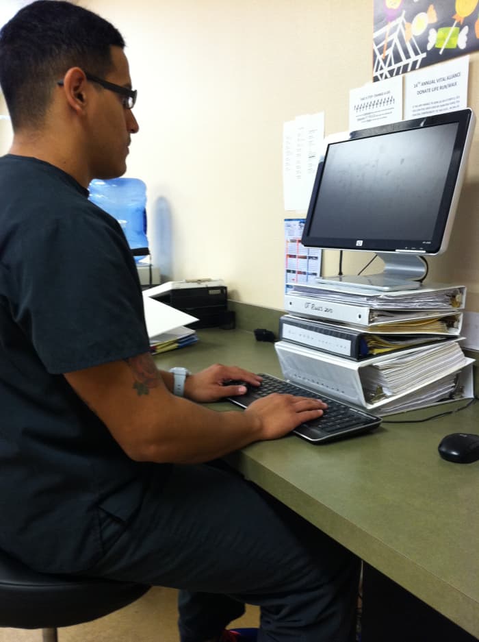 The monitor should be around eye level, the ears in line with the shoulders, arms at the sides, and the elbow angles opened up from 90 degrees.