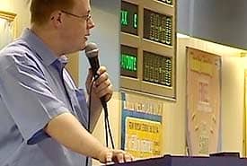 This is a bingo caller in a professional hall. You don't need to be this good, but you can learn a lot from them should you ever need to call a game of bingo.