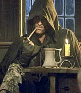 Aragorn the Ranger smokes a pipe at Inn of the Prancing Pony in Bree.