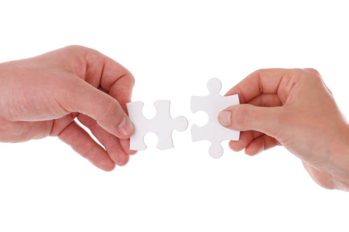 Solving a jigsaw puzzle with someone else can lead to cooperation.