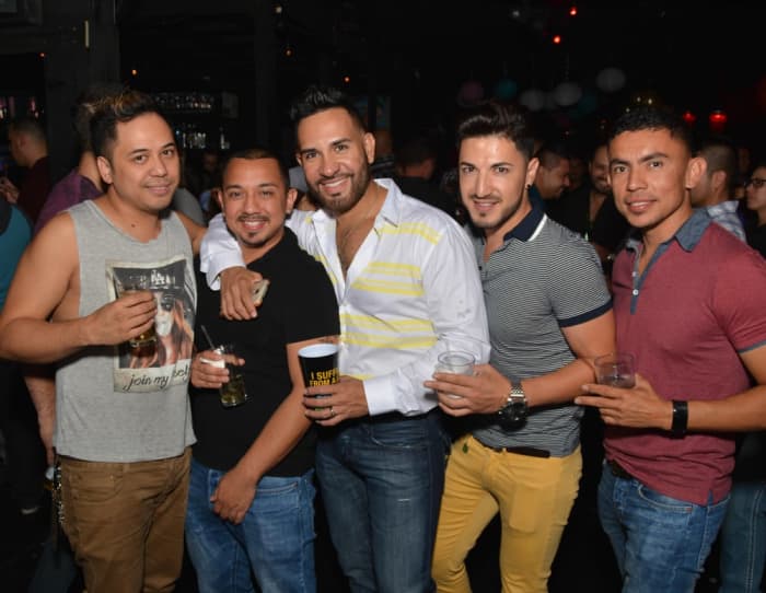Tank tops are too casual for most salsa clubs. Long-sleeve button shirts or short-sleeved polos look best.