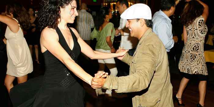 Newspaper boy hats are a popular style for men in salsa clubs