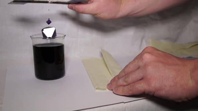 Take your finished crystal out of the water, wipe it with a paper towel, and cover it with colorless varnish.