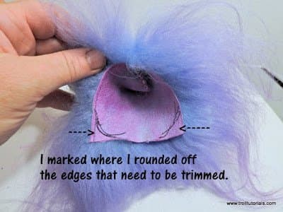 10. I marked where to trim. Slip a small pair of scissors carefully under the hide as close to the leather as possible and take tiny snips to remove the excess. Don't go cutting through the hair and ruin it! You should have very minimal hair loss.