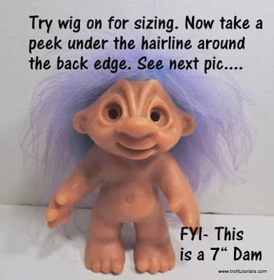 7. Now try the wig on your troll for sizing. You may notice that around the back edges it sticks out past the neck or goes too low down on the back.