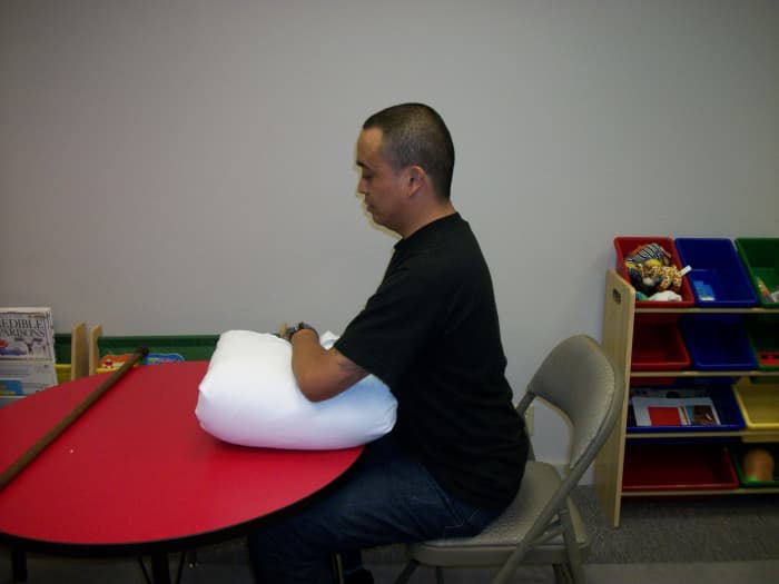 Unweight the Shoulder: Place your arm on a pillow and let the neck and shoulder muscles relax.