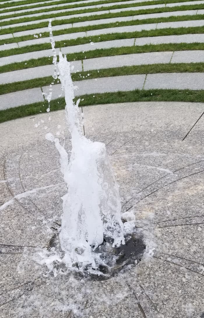 There is a lovely refreshing water fountain at the center of the 11-circuit labyrinth on the Rose Kennedy Greenway in Boston.