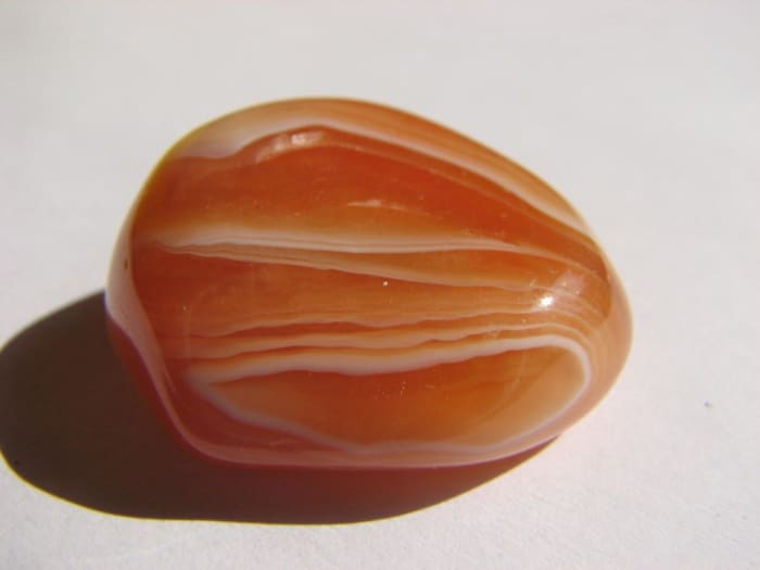 Carnelian can be found in sahdes of red, orange, pink and brown. It can also be banded.