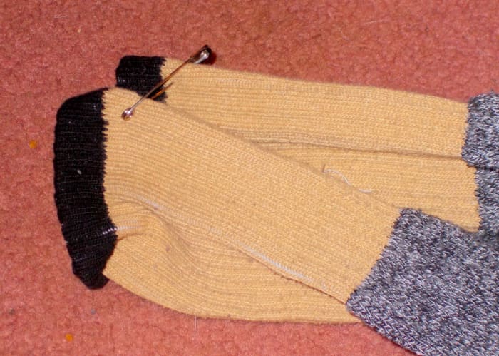 Using pins to keep socks together will help with laundry as well as dressing for the person with a visual impairment.