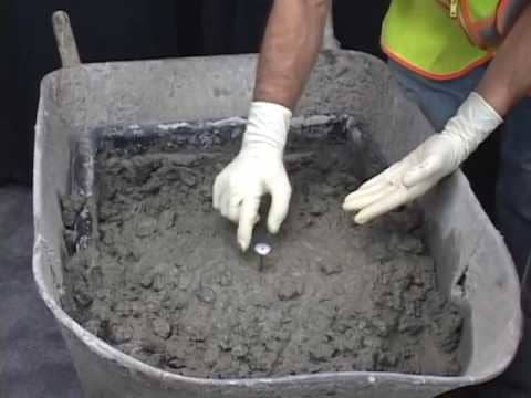 ASTM C1064 requires you to mix the sample up thoroughly for the most representative temperature value. Placing the concrete thermometer in the middle of your container is the optimum spot.