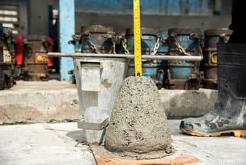 To measure your slump, measure down from the height of your slump cone, using your tamping rod to provide a marker to measure from.