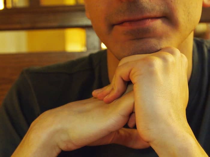 Cracking one's knuckles can pose such a source of noise--for those around you.