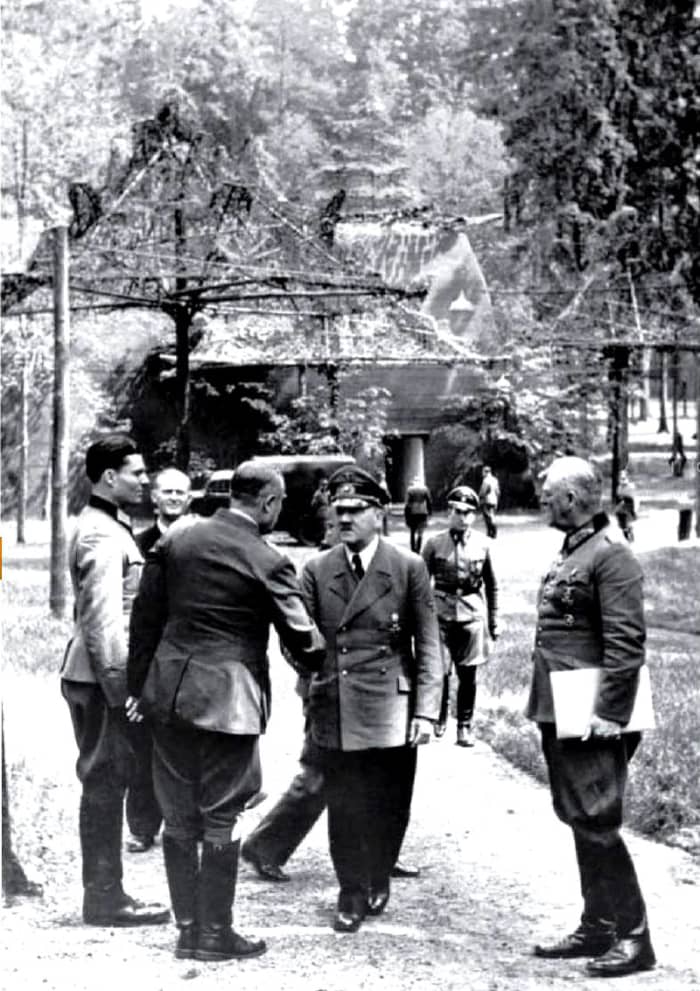 Claus von Stauffenberg (Left) alongside Adolf Hitler (Middle) and various Nazi officers. This photo was taken only a few minutes before Operation Valkyrie went into effect.
