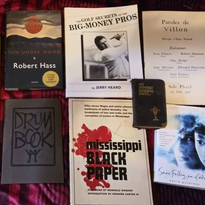 A sampling of used books a bookseller might have waiting to be priced
