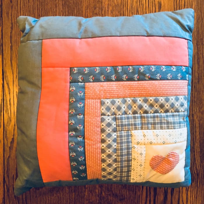 This pillow is 12" x 12." Yours can be larger. My "logs" range from 7/8" to 2 1/4" wide but all of your strips could be the same width. My starting square is 3" x 3" placed in a corner. Your square could be larger, placed in the center, or both!