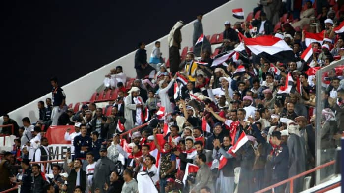 In Doha, Qatar, fans inside Suheim bin Hamad Stadium celebrate during a 2019 Asian Cup qualifier between Yemen and Nepal on Mar. 27, 2018. Yemen won the match 2-1 to secure its first Asian Cup as a unified nation.