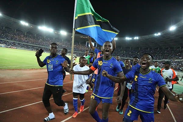 Tanzanian players and fans celebrate inside the National Main Stadium in Dar Es Salaam on Mar. 24, 2019. Tanzania defeated Uganda 3-0 to clinch only its second Africa Cup of Nations berth, but first since 1980.